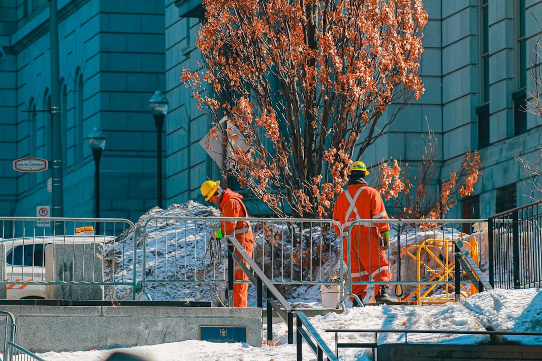 Seasonal workers in bright safety vests working outdoors during peak business season