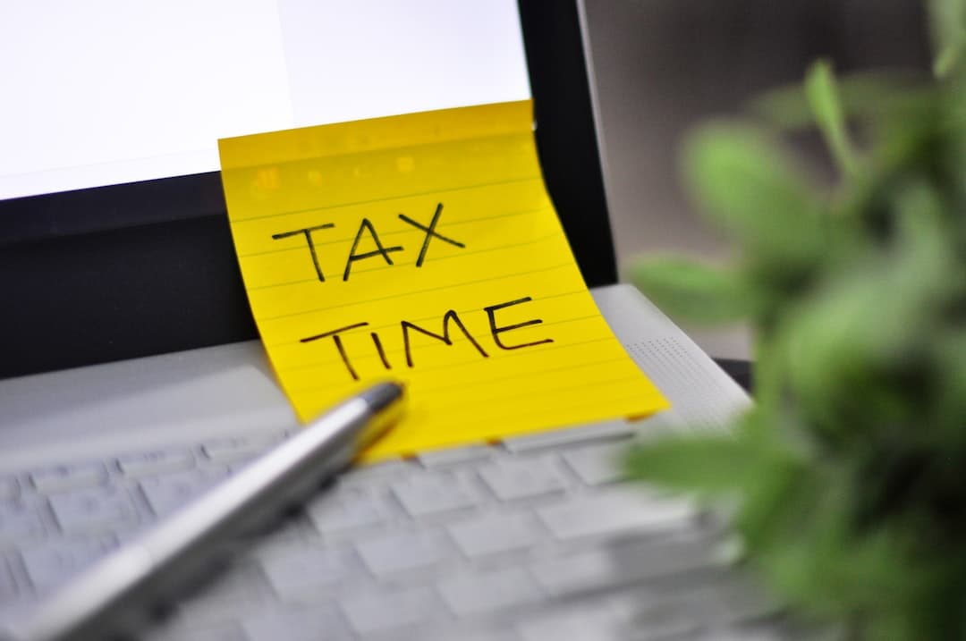 Business professional reviewing tax documents with US map in background