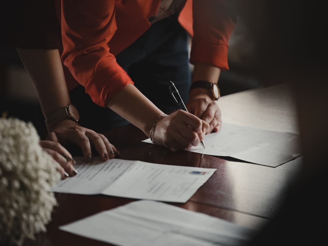 Business professionals reviewing documents during a corporate merger meeting