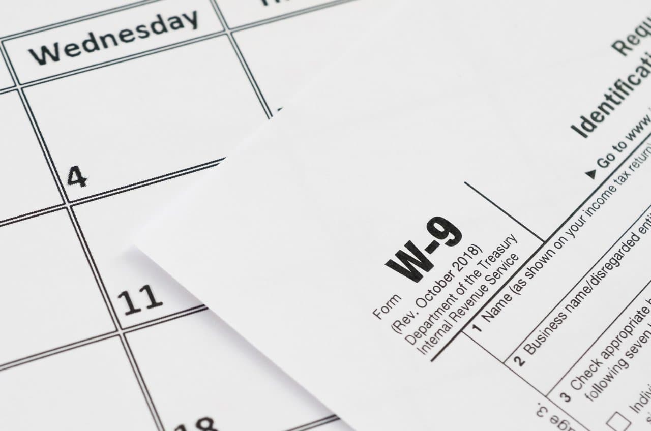 W-9 tax form on a calendar