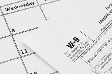 W-9 tax form on a calendar